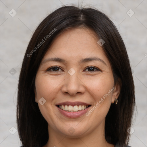 Joyful white adult female with medium  brown hair and brown eyes