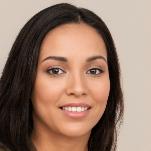 Joyful white young-adult female with long  brown hair and brown eyes