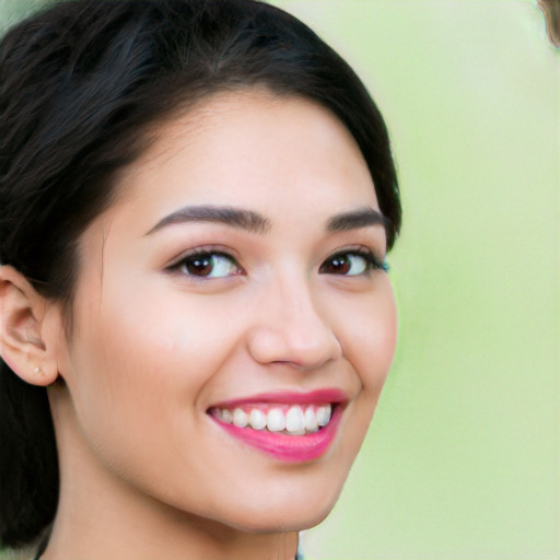 Joyful white young-adult female with long  black hair and brown eyes