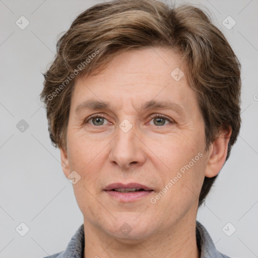 Joyful white adult male with short  brown hair and grey eyes