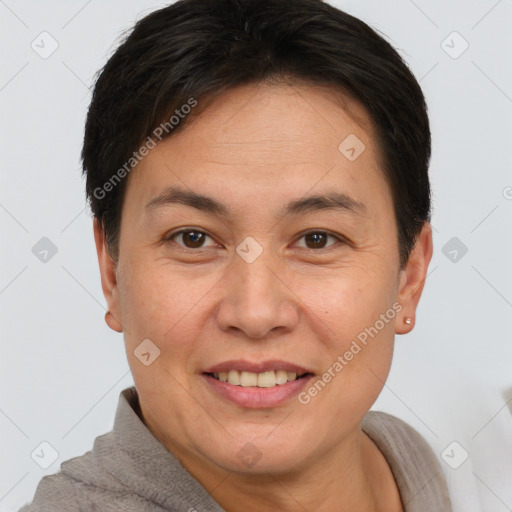 Joyful white adult female with short  brown hair and brown eyes