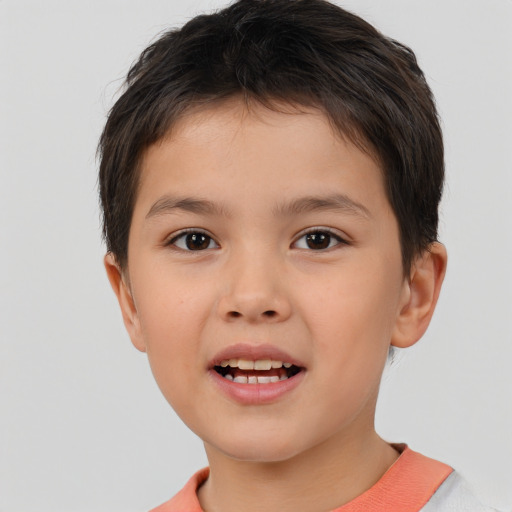 Joyful white child male with short  brown hair and brown eyes