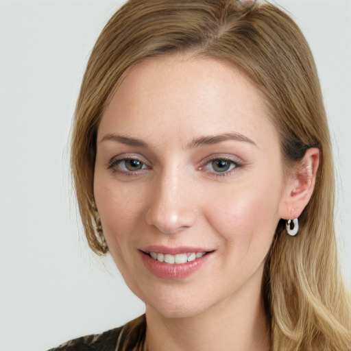 Joyful white young-adult female with long  brown hair and blue eyes