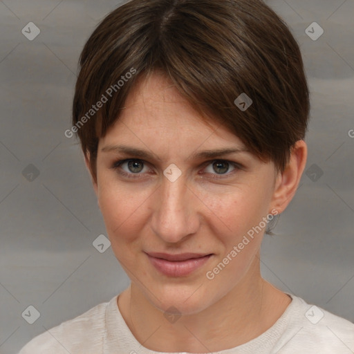 Joyful white young-adult female with short  brown hair and grey eyes