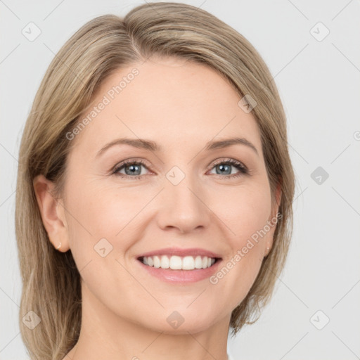 Joyful white adult female with medium  brown hair and green eyes