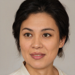 Joyful white adult female with medium  brown hair and brown eyes