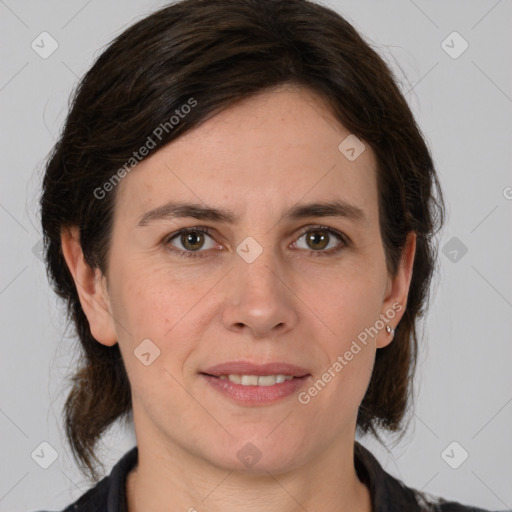 Joyful white adult female with medium  brown hair and brown eyes