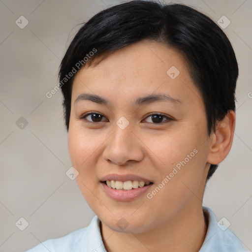 Joyful asian young-adult female with short  brown hair and brown eyes