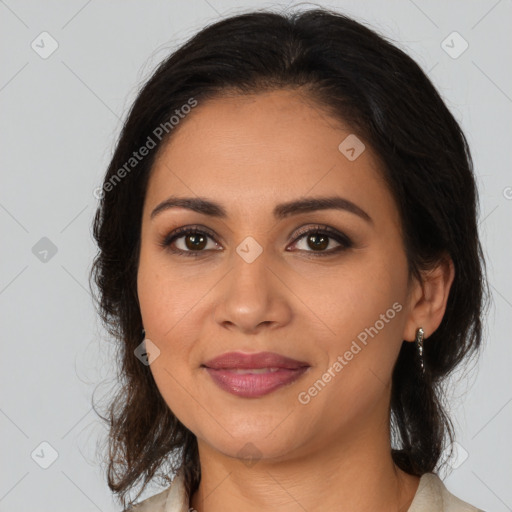 Joyful latino young-adult female with medium  brown hair and brown eyes