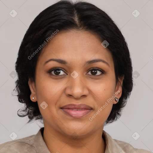 Joyful black adult female with medium  brown hair and brown eyes