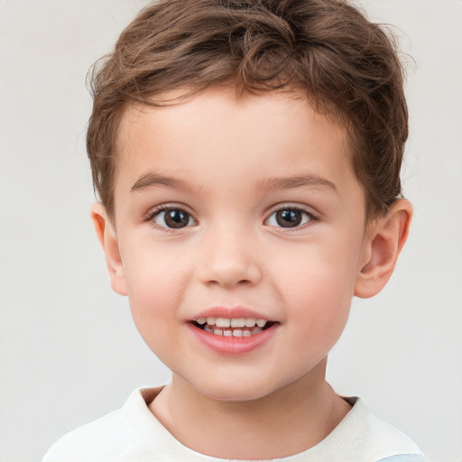 Joyful white child male with short  brown hair and brown eyes