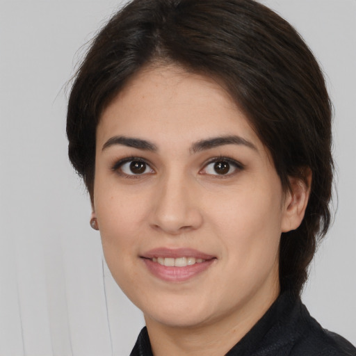 Joyful white young-adult female with medium  brown hair and brown eyes