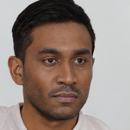 Neutral latino young-adult male with short  black hair and brown eyes
