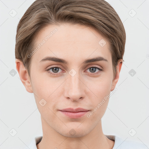 Joyful white young-adult female with short  brown hair and grey eyes