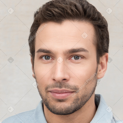 Neutral white young-adult male with short  brown hair and brown eyes