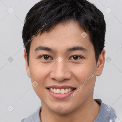 Joyful asian young-adult male with short  brown hair and brown eyes