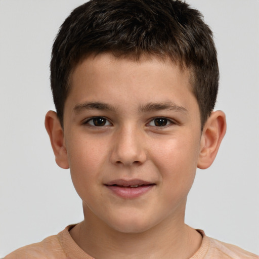 Joyful white child male with short  brown hair and brown eyes