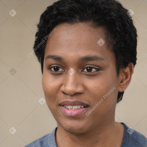 Joyful black young-adult female with short  black hair and brown eyes