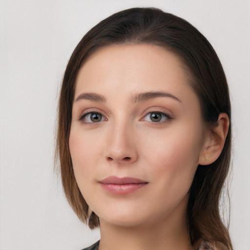 Neutral white young-adult female with long  brown hair and blue eyes