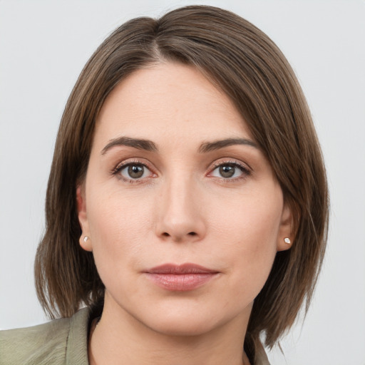 Neutral white young-adult female with medium  brown hair and grey eyes