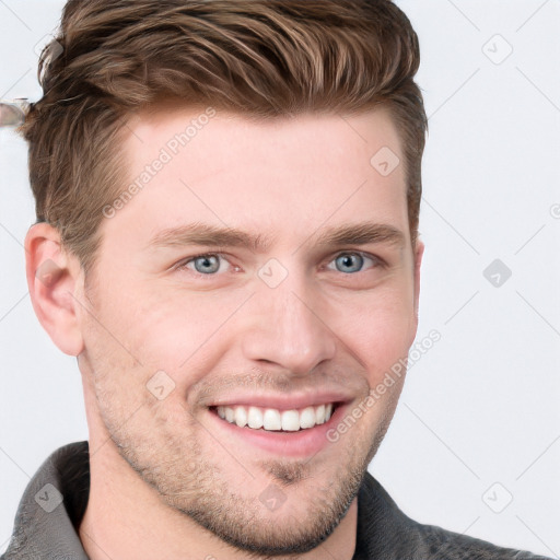 Joyful white young-adult male with short  brown hair and blue eyes