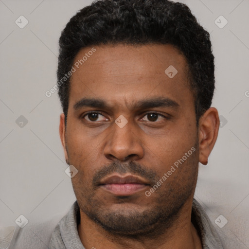 Neutral latino young-adult male with short  black hair and brown eyes