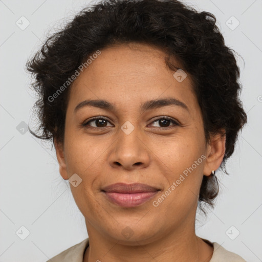 Joyful latino adult female with short  brown hair and brown eyes