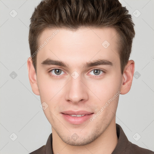 Neutral white young-adult male with short  brown hair and grey eyes