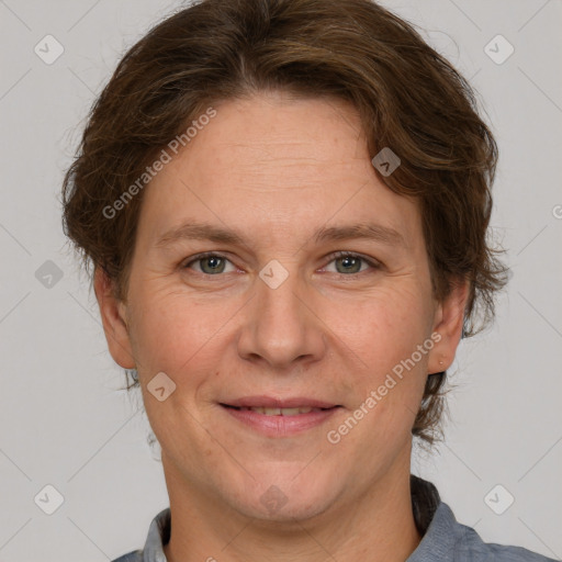 Joyful white adult female with short  brown hair and grey eyes