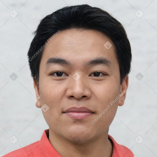 Joyful asian young-adult male with short  black hair and brown eyes