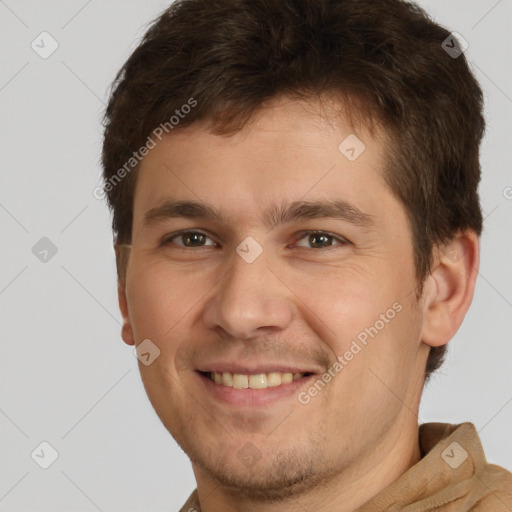 Joyful white young-adult male with short  brown hair and brown eyes