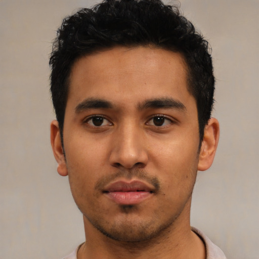 Neutral latino young-adult male with short  black hair and brown eyes