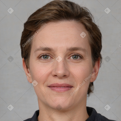 Joyful white adult female with short  brown hair and grey eyes