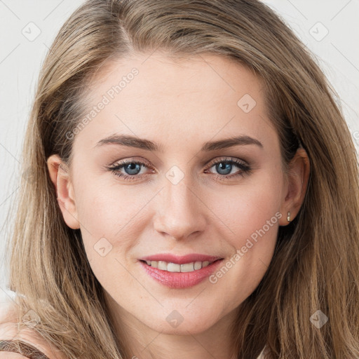 Joyful white young-adult female with long  brown hair and blue eyes