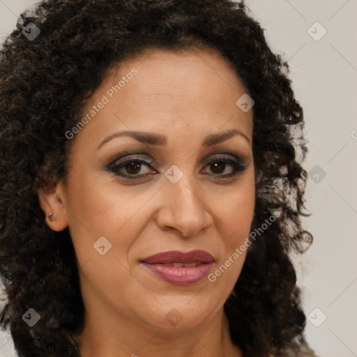 Joyful latino adult female with medium  brown hair and brown eyes