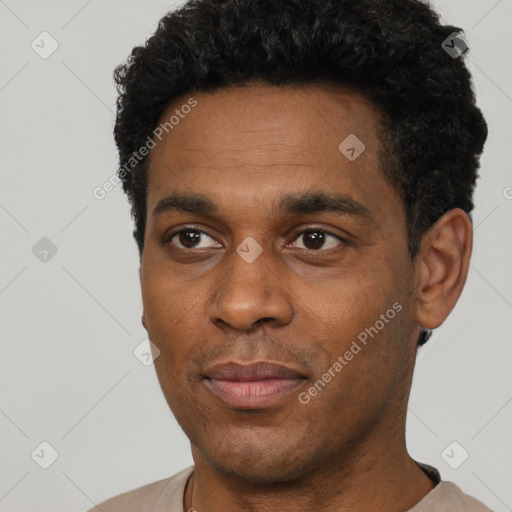 Joyful black young-adult male with short  black hair and brown eyes