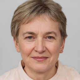 Joyful white middle-aged female with short  brown hair and brown eyes