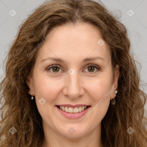 Joyful white adult female with long  brown hair and brown eyes