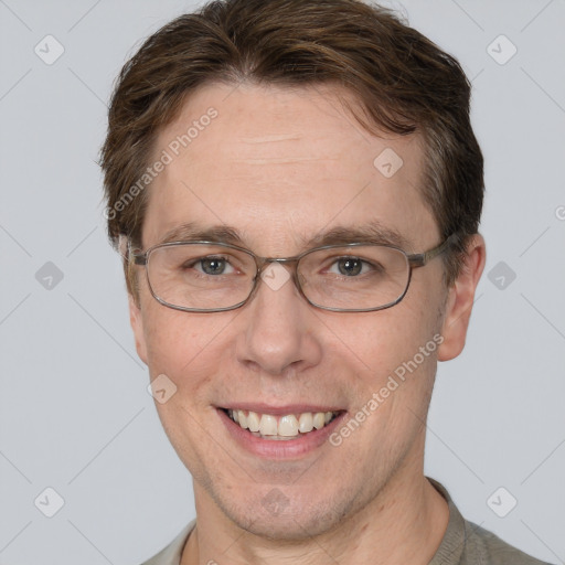 Joyful white adult male with short  brown hair and grey eyes