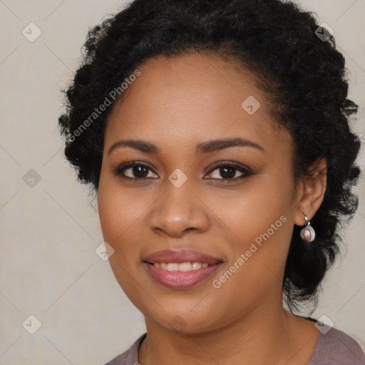 Joyful black young-adult female with long  brown hair and brown eyes