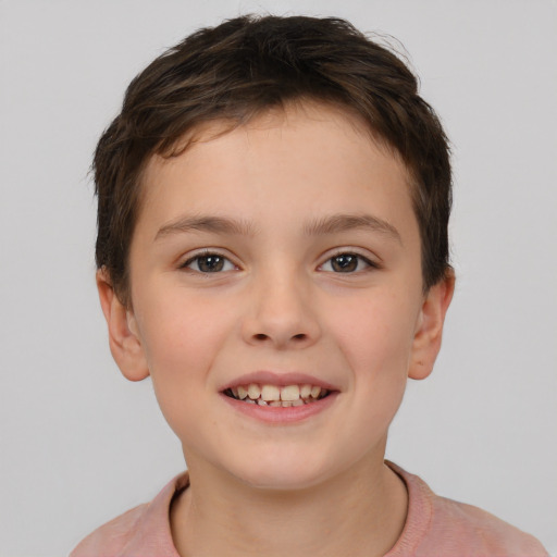 Joyful white child female with short  brown hair and brown eyes