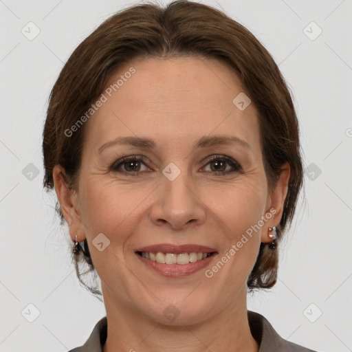 Joyful white adult female with medium  brown hair and brown eyes