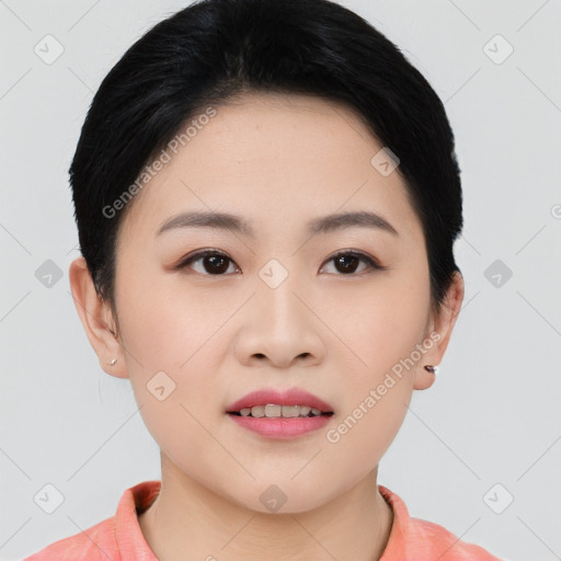 Joyful asian young-adult female with short  black hair and brown eyes