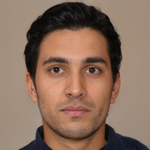 Neutral latino young-adult male with short  black hair and brown eyes