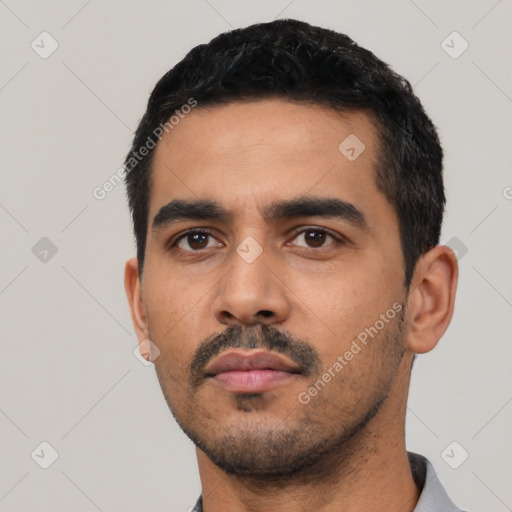 Neutral latino young-adult male with short  black hair and brown eyes