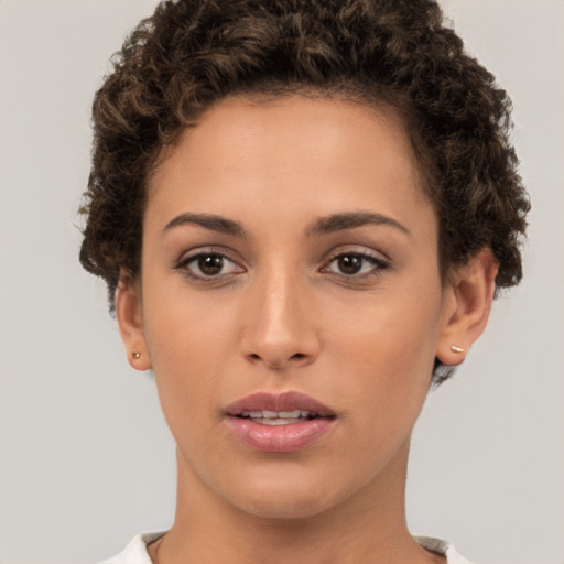 Neutral white young-adult female with short  brown hair and brown eyes