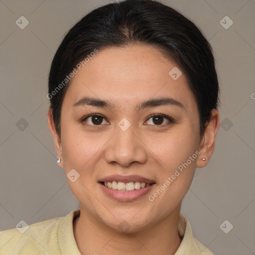 Joyful asian young-adult female with short  brown hair and brown eyes