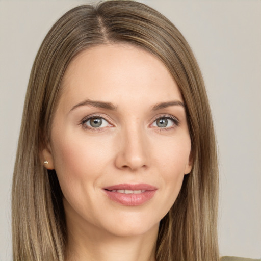 Joyful white young-adult female with long  brown hair and grey eyes