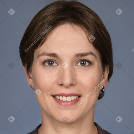 Joyful white young-adult female with short  brown hair and grey eyes