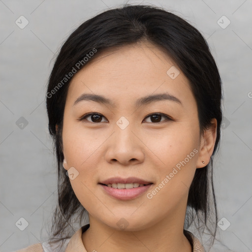 Joyful asian young-adult female with medium  black hair and brown eyes